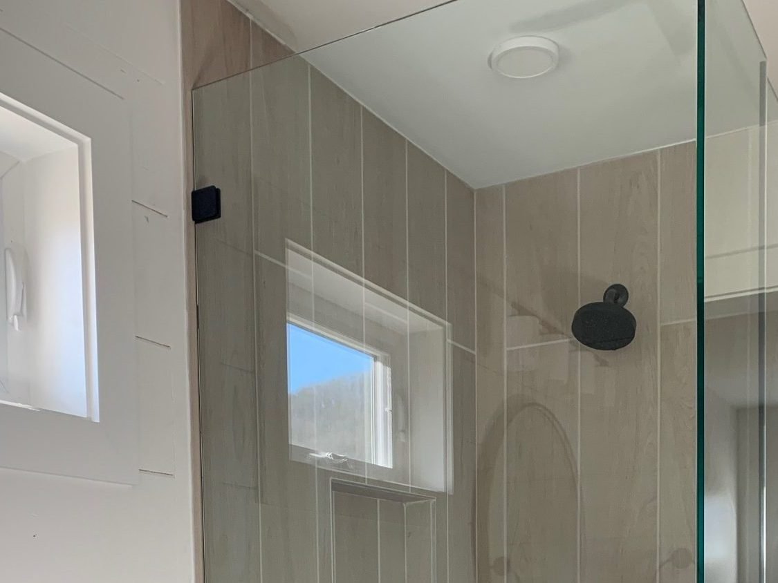 Custom tile shower with frameless glass