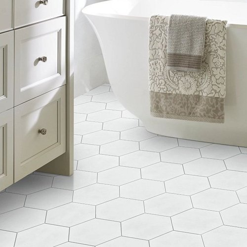 Bathroom with white hexagonal tiles from Value Flooring Kitchens & Baths in Cleveland, TN
