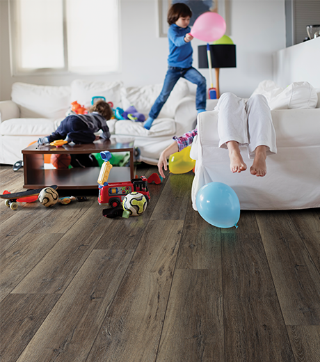 kids playing in room with wood-look laminate flooring from Value Flooring Kitchens & Baths in Cleveland, TN